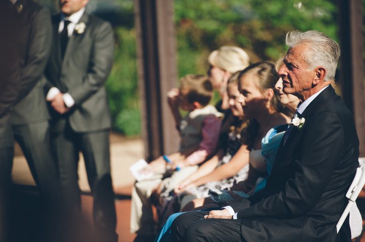 Father of groom during a wedding ceremony at the Phoenixville Foundry in Phoenixville, Pa. Captured by Northern NY wedding photographer Ben Lau.
