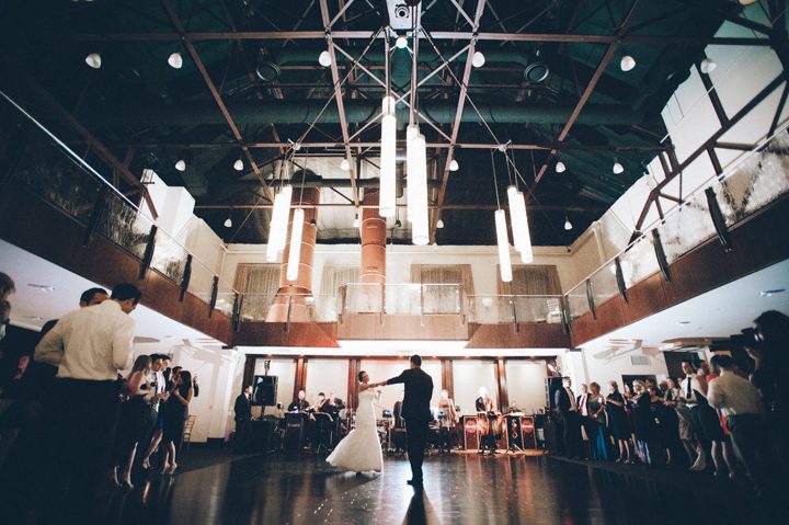 Bride and groom's first dance during their wedding reception at the Phoenixville Foundry in Phoenixville, Pa. Captured by Northern NY wedding photographer Ben Lau.