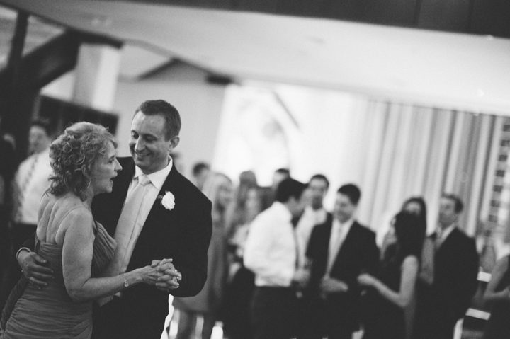 Mother and son dance during a wedding reception at the Phoenixville Foundry in Phoenixville, Pa. Captured by Northern NY wedding photographer Ben Lau.