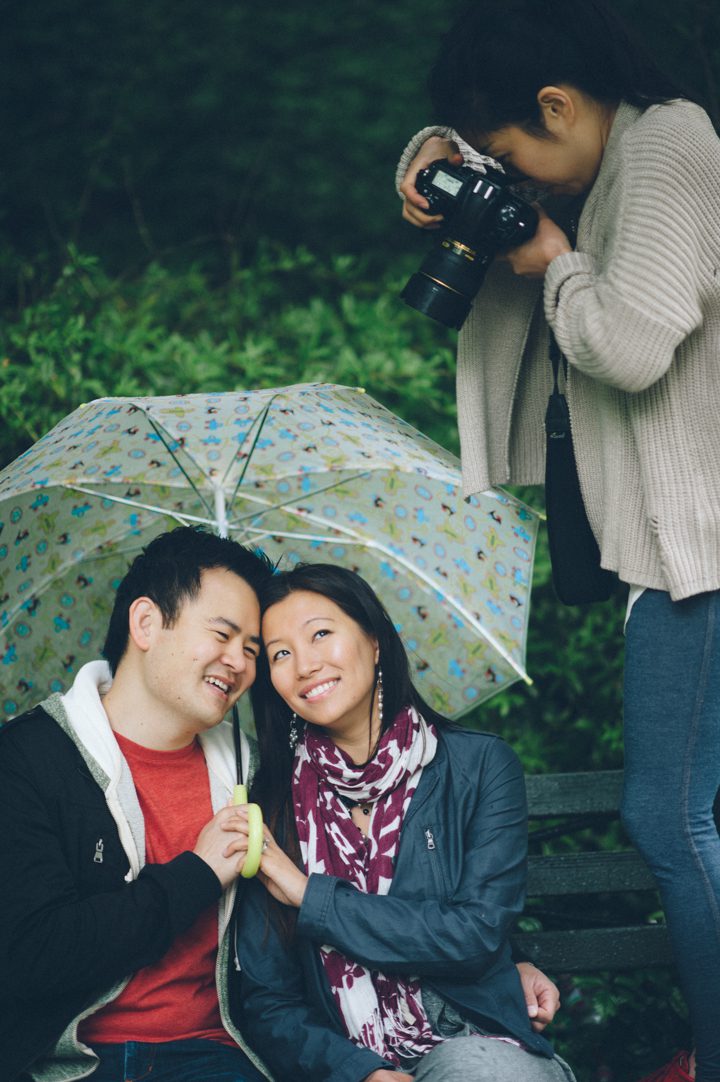 Behind the scenes during a rainy engagement session in Prospect Park with NYC wedding photographer Ben Lau.