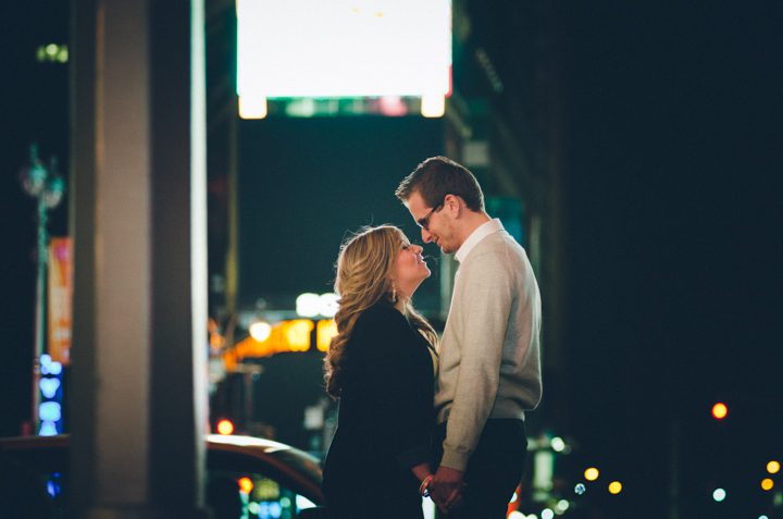 Karina and Nick pose on a street corner in Times Square during their engagement session with NYC wedding photographer Ben Lau.
