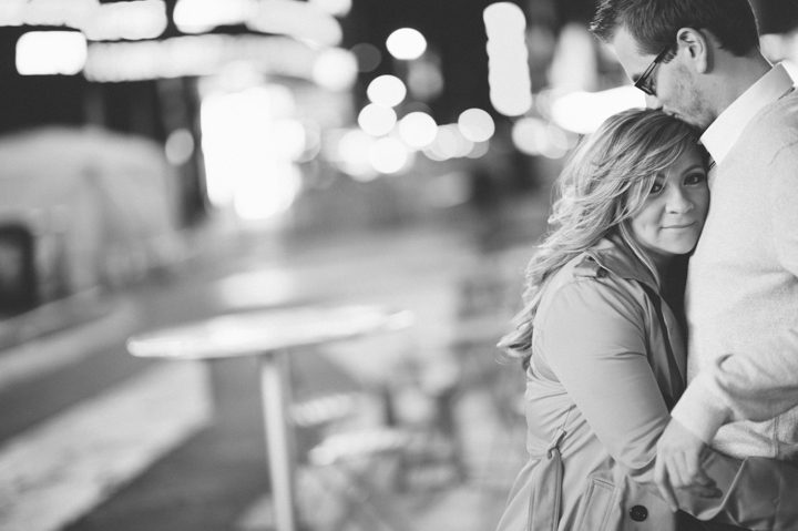 Nick and Karina hug in Times Square during their engagement session with NYC wedding photographer Ben Lau.