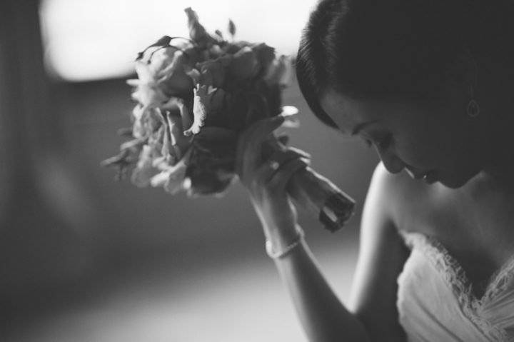 Bride holding her bouquet on the morning of her wedding at the Hempstead House in Sands Point Preserve, Long Island. Captured by NYC wedding photographer Ben Lau.