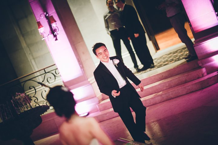 Groom dances during a wedding reception at the Hempstead House in Sands Point Preserve, Long Island. Captured by NYC wedding photographer Ben Lau.