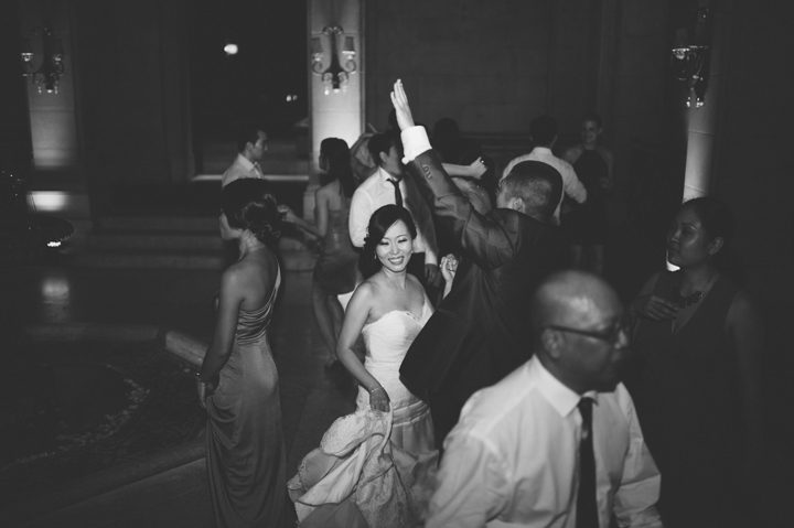 Bride dances during a wedding reception at the Hempstead House in Sands Point Preserve, Long Island. Captured by NYC wedding photographer Ben Lau.
