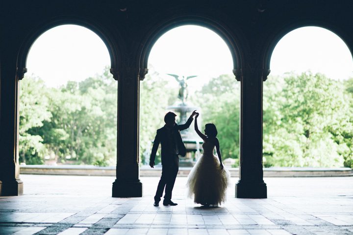 Bride and groom dance under the archways at Central Park during their bridal session with NYC wedding photographer Ben Lau.