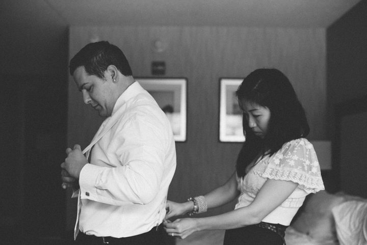 Groom preps on the morning of his wedding at the Old Tappan Manor in Old Tappan, NJ. Captured by Northern New Jersey Wedding Photographer Ben Lau.