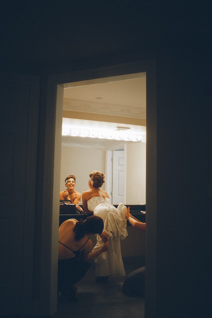 Bride getting bustled at a wedding reception at the Old Tappan Manor in Old Tappan, NJ. Captured by Northern New Jersey Wedding Photographer Ben Lau.