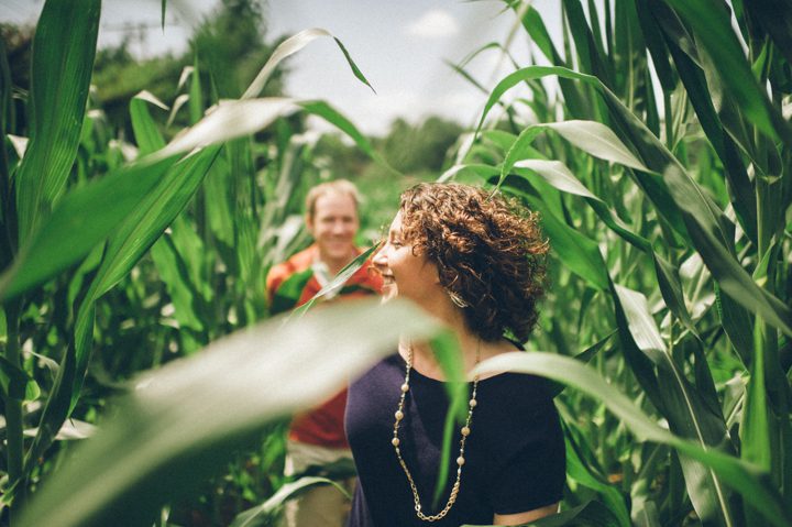 Couple run in a cornfield during their Baltimore engagement session with NJ wedding photographer Ben Lau.
