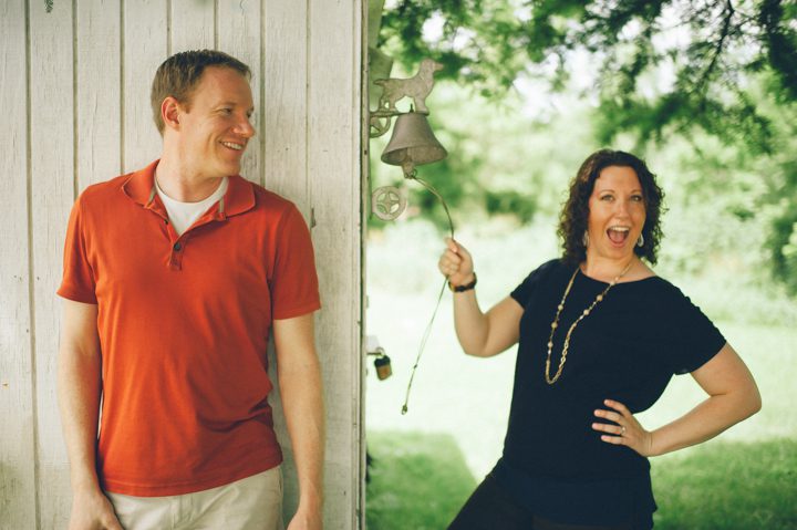 Lindsay rings a cowbell during their Baltimore engagement session with NJ wedding photographer Ben Lau.