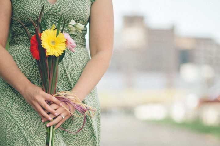 Girl holds flowers during her Baltimore engagement session with NJ wedding photographer Ben Lau.