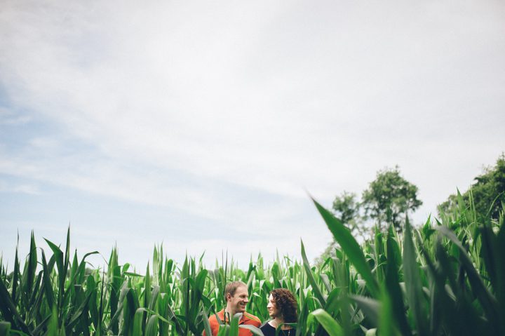 Couple stand in a cornfield during their Baltimore engagement session with NJ wedding photographer Ben Lau.