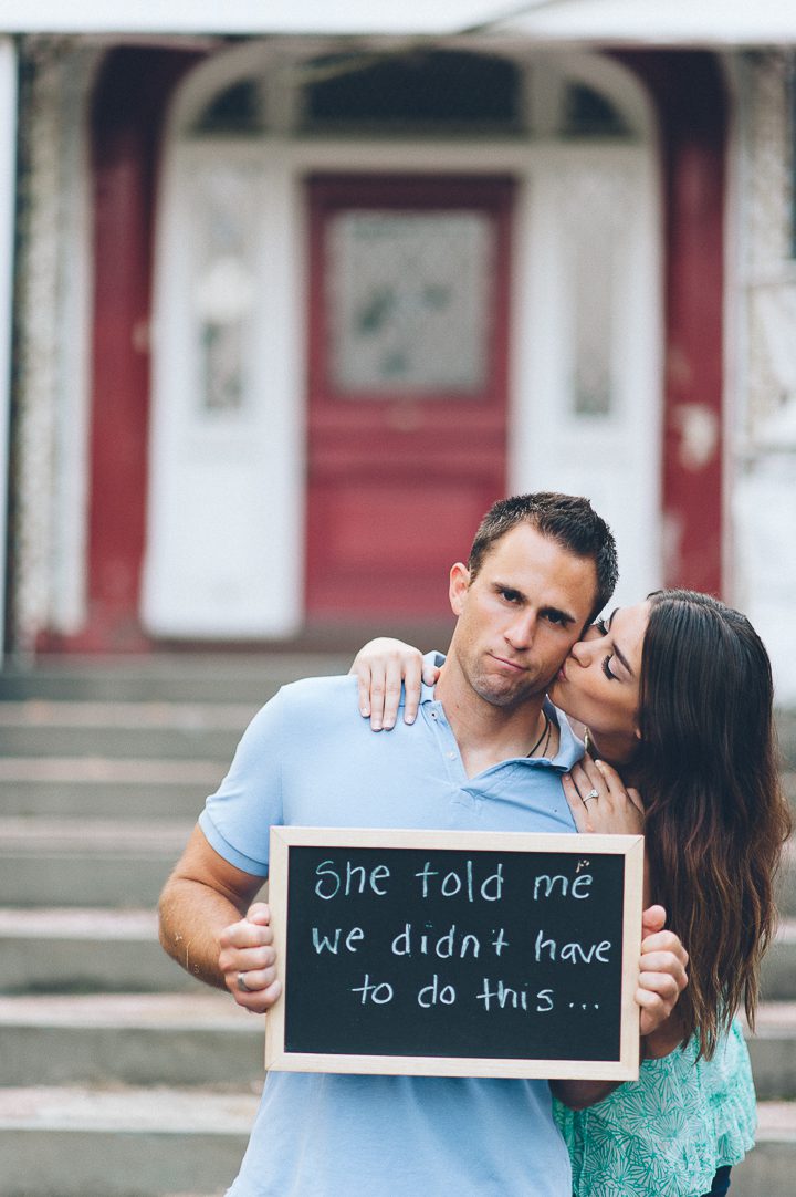 Couple uses chalkboard during their engagement session in Morristown with NJ wedding photographer Ben Lau.