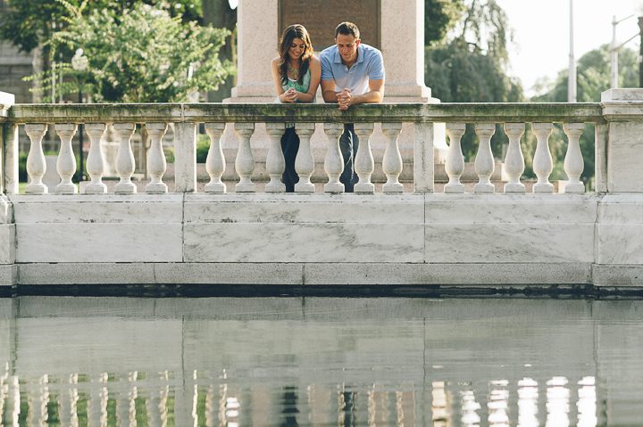 Couple stand by a reflecting pool during their engagement session in Morristown with NJ wedding photographer Ben Lau.