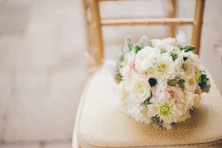 Wedding flowers on a chair at the Stone House in Stirling Ridge. Captured by NJ wedding photographer Ben Lau.