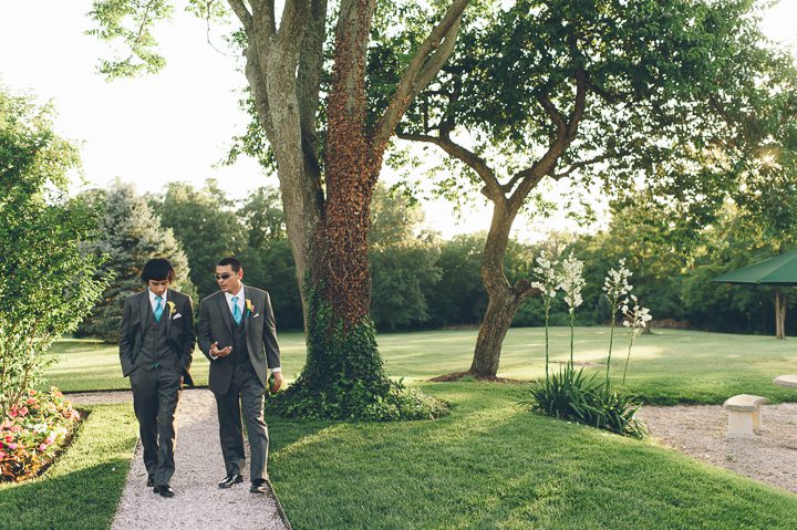 Groomsmen take a stroll at the Antrim 1844 Country House in Taneytown, MD. Captured by Baltimore wedding photographer Ben Lau.