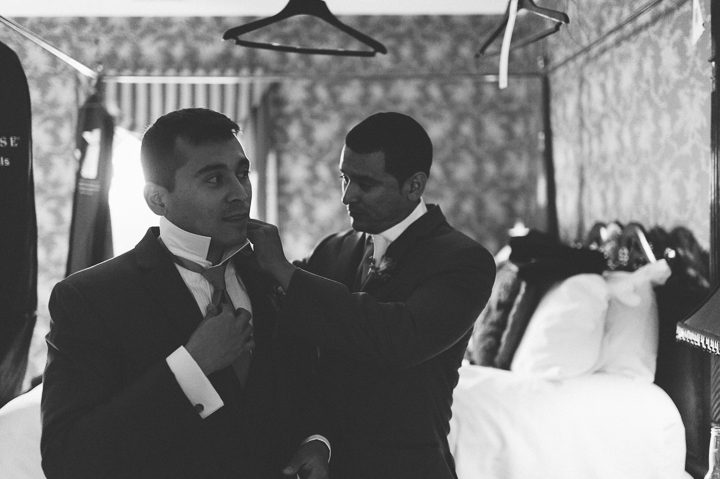 Groom gets ready at the Antrim 1844 Country House in Taneytown, MD. Captured by Baltimore wedding photographer Ben Lau.