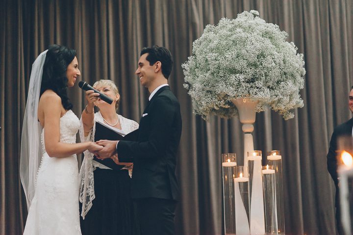 Wedding ceremony at the Tribeca Rooftop. Captured by NYC wedding photographer Ben Lau.