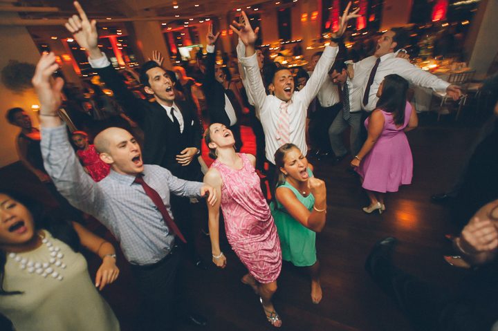 Guests dancing during a wedding reception at the Tribeca Rooftop. Captured by NYC wedding photographer Ben Lau.