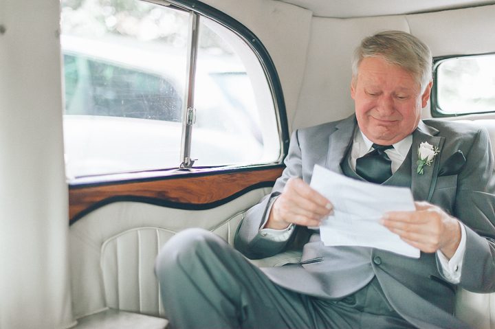 Father of the bride reads a letter from his daughter in the limo en route to a Westmount Country Club wedding.