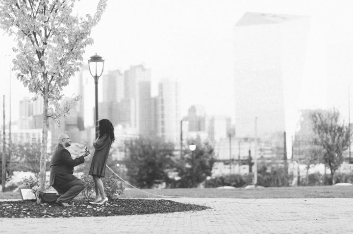 Engagement taking place with Philly skyline.