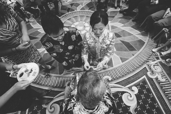 Chinese Tea Pouring Ceremony at the Ritz Carlton in San Francisco, CA. Captured by NYC wedding photographer Ben Lau.