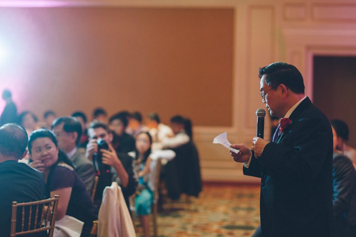 Father of the groom speaks during a wedding reception at the Ritz Carlton in San Francisco, CA. Captured by NYC wedding photographer Ben Lau.