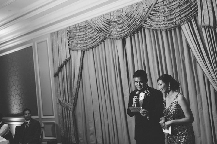Toasts during a wedding reception at the Ritz Carlton in San Francisco, CA. Captured by NYC wedding photographer Ben Lau.