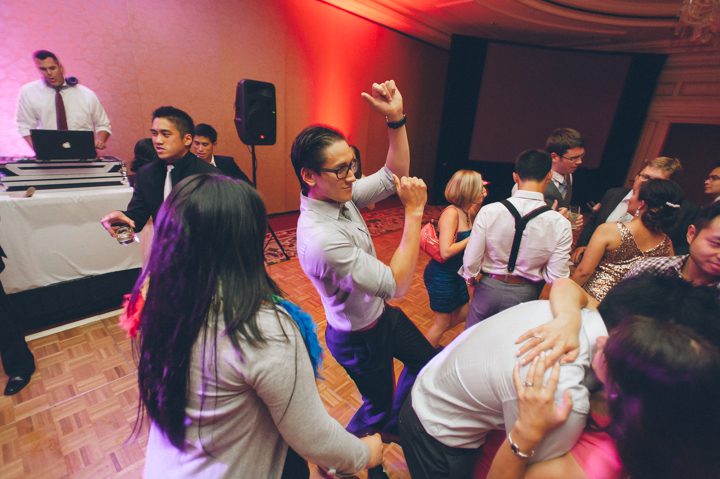 Guests dance during a wedding reception at the Ritz Carlton in San Francisco, CA. Captured by NYC wedding photographer Ben Lau.