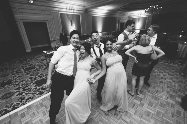Guests dance during a wedding reception at the Ritz Carlton in San Francisco, CA. Captured by NYC wedding photographer Ben Lau.