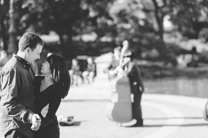 Melanie and Daniel dance by Bethesda Fountain in Central Park during their engagement session with NYC wedding photographer Ben Lau.