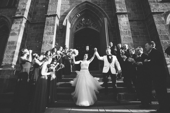 Bride and groom exit their St. Peter the Apostle Church wedding in New Brunswick, NJ. Captured by NJ wedding photographer Ben Lau.