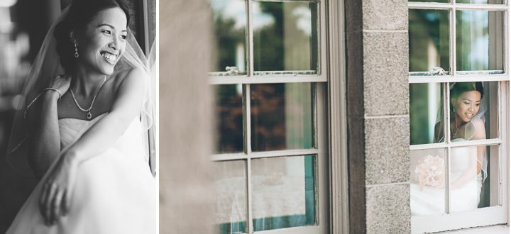 Bride looks out window on the morning of her wedding day at Tappan Hill Mansion in Tarrytown, NY. Captured by NYC wedding photographer Ben Lau.