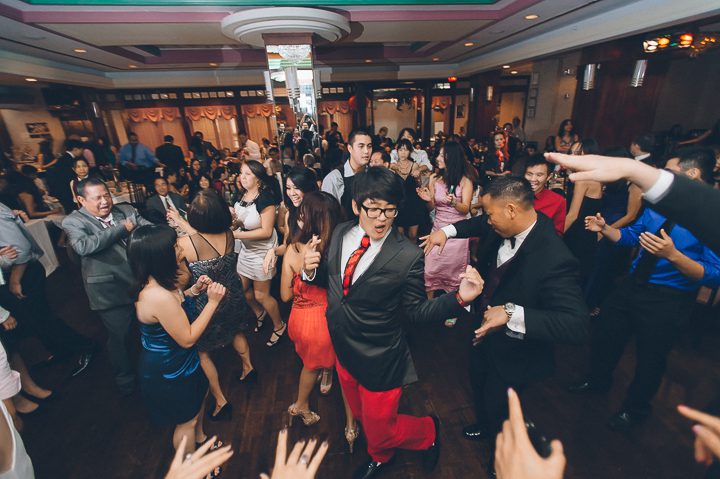 Guest dance during a wedding reception at China Garden in Rosslyn, Northern Virginia. Captured by NYC wedding photographer Ben Lau.