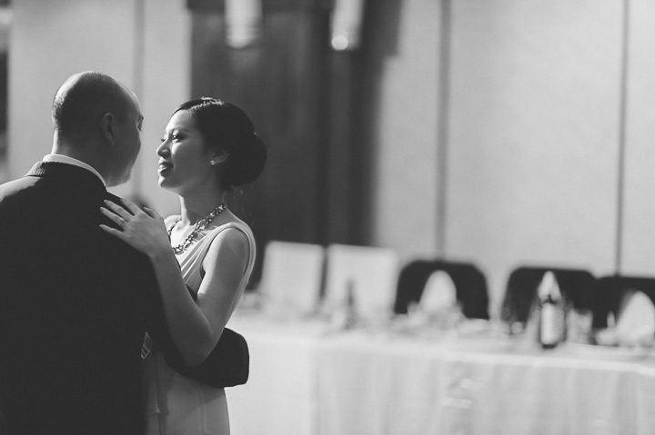Bride and groom's first dance during a wedding reception at China Garden in Rosslyn, Northern Virginia. Captured by NYC wedding photographer Ben Lau.