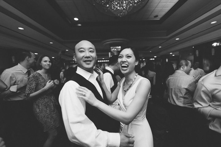 Bride and groom dance during a wedding reception at China Garden in Rosslyn, Northern Virginia. Captured by NYC wedding photographer Ben Lau.
