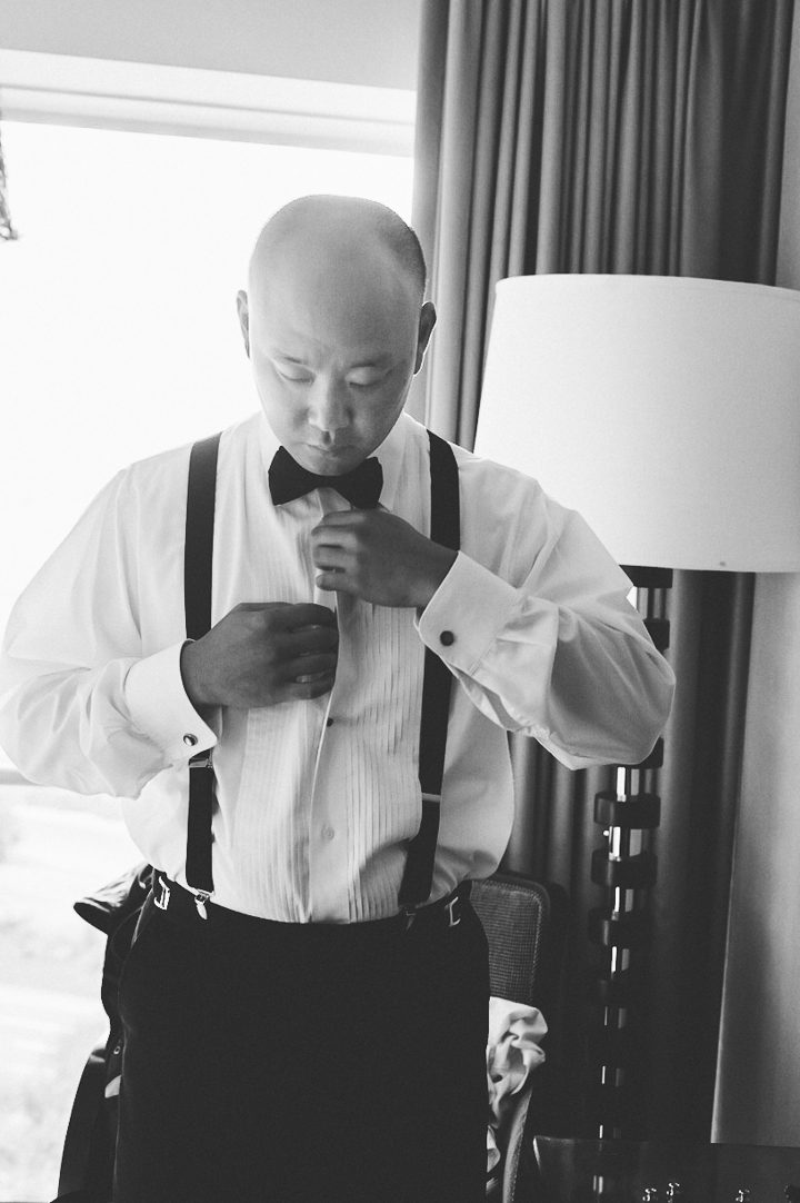 Groom gets ready for his wedding day at the Crystal City Le Meridian in Northern Virginia. Captured by NYC wedding photographer Ben Lau.
