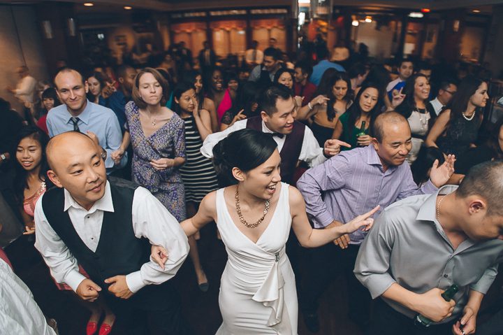 Bride and groom dance during their wedding night at the China Garden Restaurant in Rosslyn, VA. Captured by NYC wedding photographer Ben Lau.