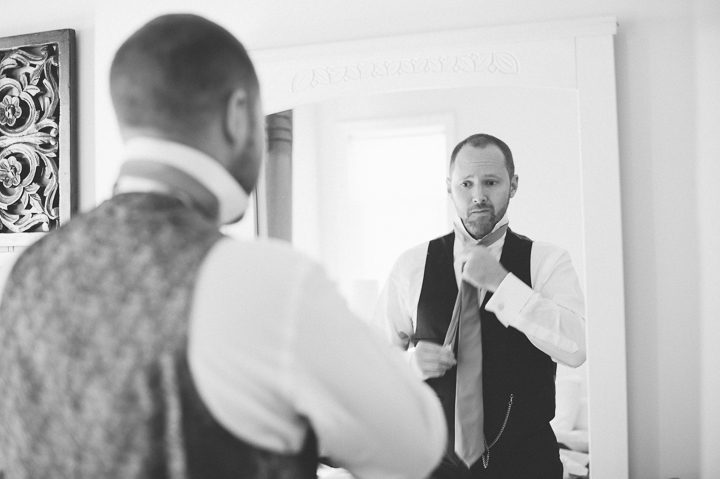 Groom preps on the morning of his wedding day  at Oceanbleu in Westhampton, NY. Captured by NYC wedding photographer Ben Lau.