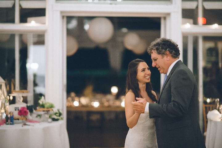 Bride and her father dance during a wedding reception at Oceanblue/Westhampton Bath & Tennis in Westhampton, NY. Captured by NYC wedding photographer Ben Lau.