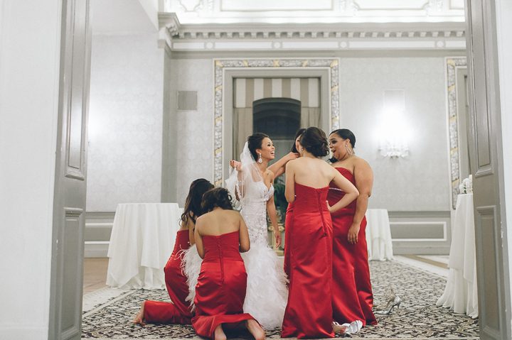 Bride gets bustled after her wedding ceremony at the Belvedere Hotel in Baltimore, MD. Captured by NYC wedding photographer Ben Lau.
