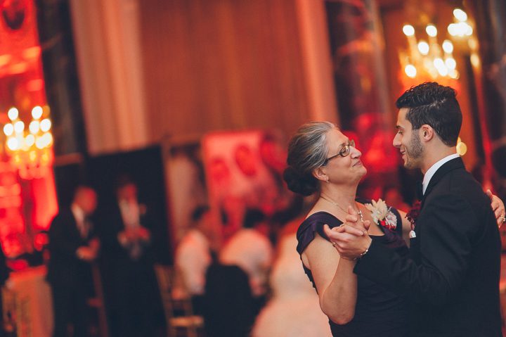 Groom dances with his mother during a wedding reception at the Belvedere Hotel. Captured by NYC wedding photographer Ben Lau.