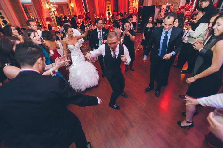 Guests dancing during a wedding reception at the Belvedere Hotel. Captured by NYC wedding photographer Ben Lau.