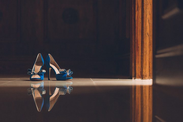 Wedding shoes photographed in a pocket of light at The Estate at Florentine Gardens in River Vale, NJ. Captured by Northern NJ wedding photographer Ben Lau.