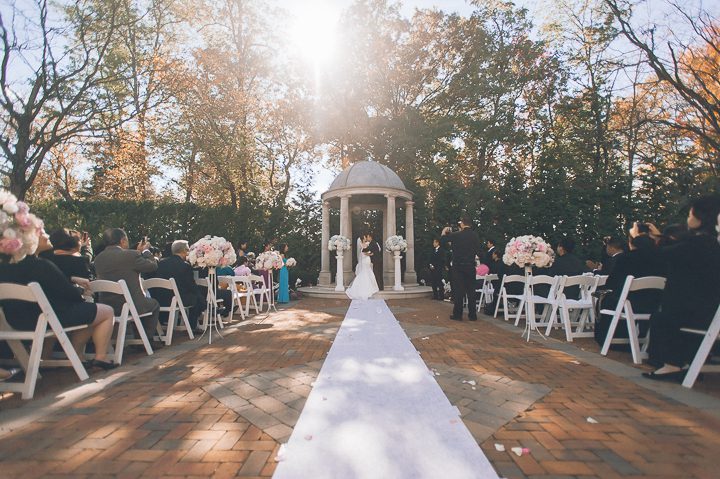 Wedding ceremony at The Estate at Florentine Gardens in River Vale, NJ. Captured by Northern NJ wedding photographer Ben Lau.