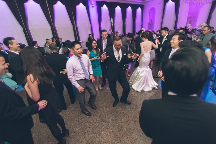 Guests dance during a wedding reception at The Estate at Florentine Gardens in River Vale, NJ. Captured by Northern NJ wedding photographer Ben Lau.