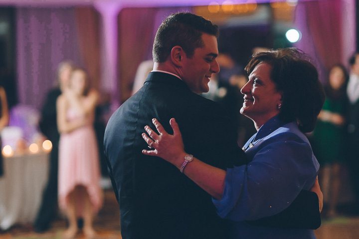 Groom dances with his mother during a wedding reception at Glen Cove Mansion. Captured by NYC wedding photographer Ben Lau.