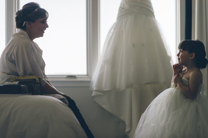 Bride and flower girl at the Bungalow Hotel for a McLoone's Pier House Wedding in Long Branch, NJ. Captured by NYC wedding photographer Ben Lau.