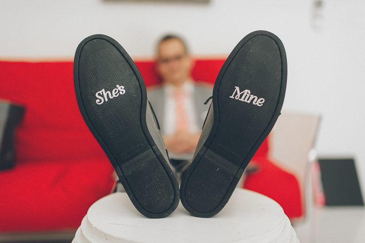 Groom's shoes stickers at the Bungalow Hotel for a McLoone's Pier House Wedding in Long Branch, NJ. Captured by NYC wedding photographer Ben Lau.