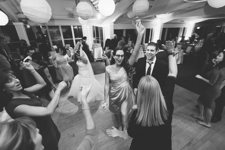 Guests dance during a McLoones Pierhouse Wedding in Long Branch, NJ. Captured by NYC wedding photographer Ben Lau.